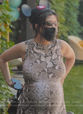 Kourtney's snake skin print top and pants on The Kardashians