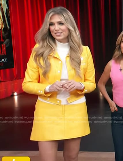 Nikki Novak's yellow leather jacket and mini skirt on Access Hollywood