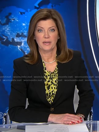 Norah’s yellow leopard blouse and black blazer on CBS Evening News