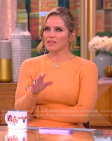 Sara’s orange knit sweater and satin skirt on The View