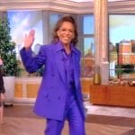 Sunny’s purple tie neck blouse and blazer on The View