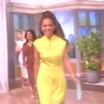 Sunny’s yellow satin mock neck dress on The View