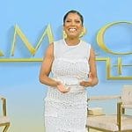 Tamron’s white smocked frill dress on Tamron Hall Show