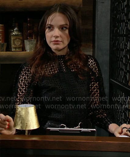 Tessa's black lace top on The Young and the Restless