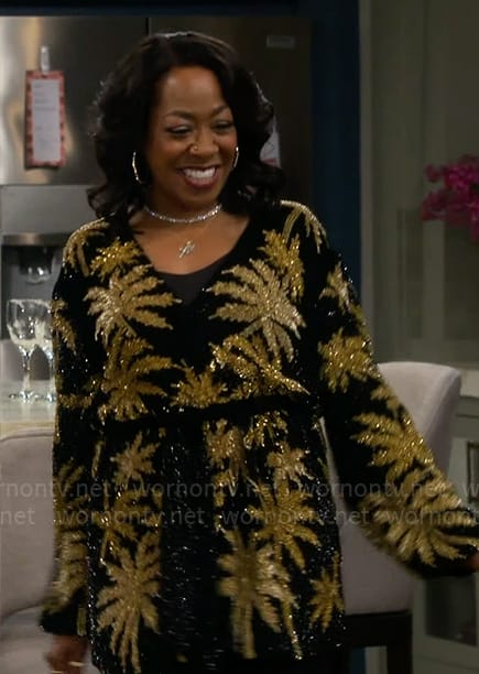 Tina's black and gold sequin palm tree dress on The Neighborhood