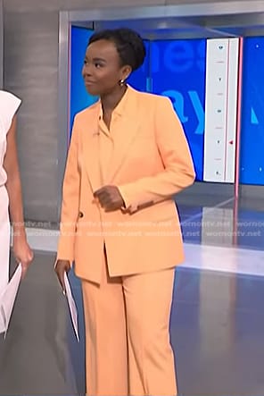 Zinhle's orange blazer and wide leg pants on NBC News Daily