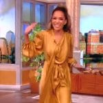 Sunny’s gold satin tie neck dress on The View