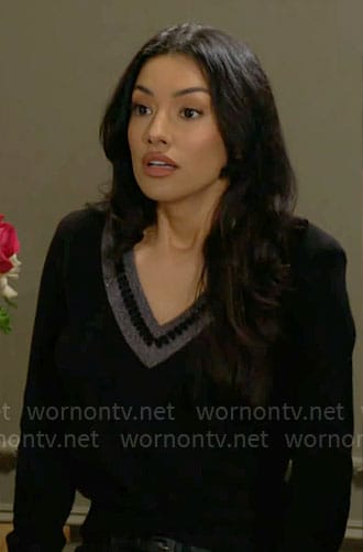 Audra's black v-neck sweater with stripe trim on The Young and the Restless