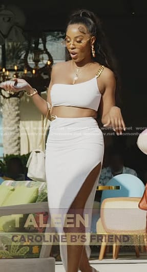 Caroline's white cropped chain strap top and skirt on The Real Housewives of Dubai