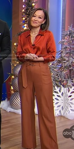 Eva’s orange satin shirt and brown belted pants on Good Morning America