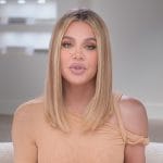 Khloe’s beige twisted shoulder confessional top on The Kardashians