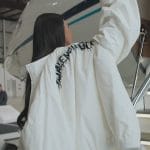 Kim’s white balenciaga jacket and snow boots on The Kardashians