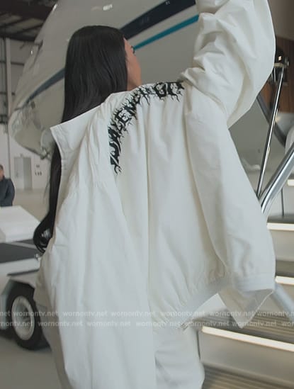 Kim's white balenciaga jacket and snow boots on The Kardashians