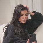 Kim’s black balenciaga logo oversized sweater on The Kardashians