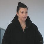 Kourtney’s black sherpa jacket on The Kardashians