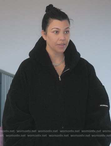 Kourtney's black sherpa jacket on The Kardashians