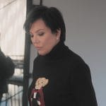 Kriss’s black teddy bear embroidered sweater on The Kardashians