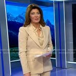 Norah’s satin blouse and beige suit on CBS Evening News