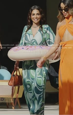 Sara's green geometric print pleated wrap dress on The Real Housewives of Dubai