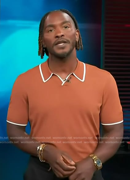 Scott’s orange ripped polo on Access Hollywood