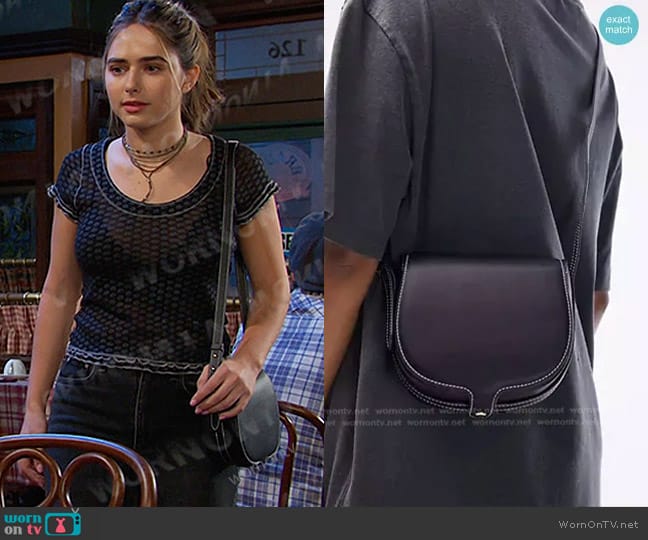 Topshop Chelsea Saddle Crossbody bag in black worn by Holly Jonas (Ashley Puzemis) on Days of our Lives