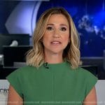 Caitlin Huey-Burns’ green belted dress on CBS Evening News