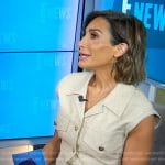 Courtney Lopez’s beige sleeveless mini shirtdress on E! News