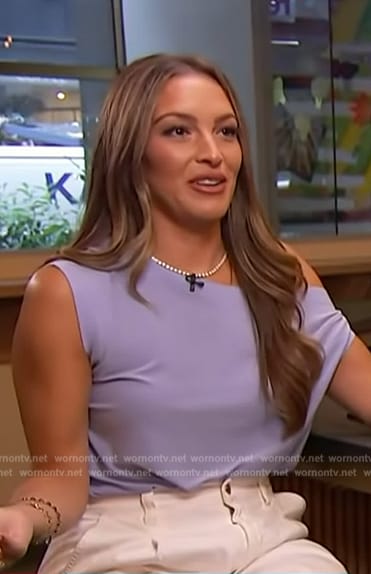 Emily Orozco's blue one shoulder top on Access Hollywood