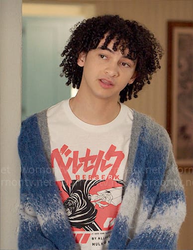 Finn's Berserk graphic tee and blue cardigan on UnPrisoned