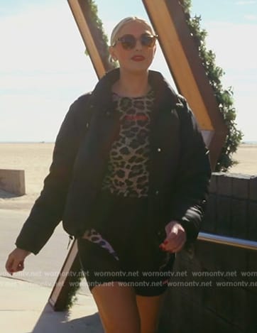 Gina's black padded jacket and leopard print top on The Real Housewives of Orange County