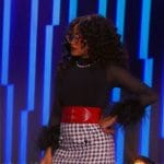 Keke Palmer’s black feather trim top and houndstooth mini skirt on Password