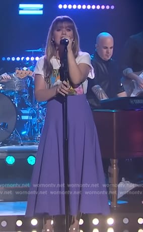 Kelly's Stevie Nick graphic tee and purple skirt on The Kelly Clarkson Show