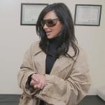 Kim’s beige trench coat on The Kardashians