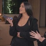 Kim’s black hoodie and sports bra on The Kardashians