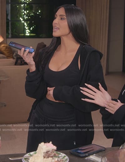 Kim's black hoodie and sports bra on The Kardashians