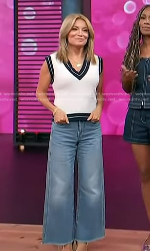 Kit's white and navy v-neck vest and wide-leg jeans on Access Hollywood