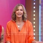 Lara’s orange satin blouse on Good Morning America