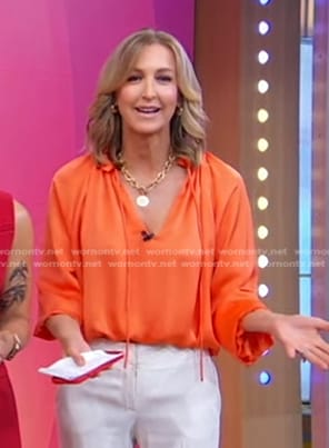 Lara’s orange satin blouse on Good Morning America