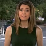 Nicole Sganga’s dark green sleeveless dress on CBS Mornings