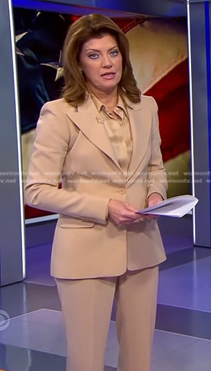 Norah's satin blouse and beige suit on CBS Evening News