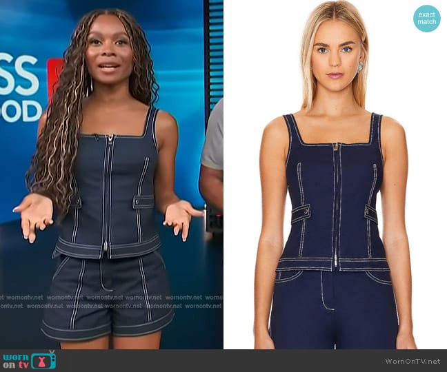 Simkhai Dolce Zip Up Top in Midnight worn by Zuri Hall on Access Hollywood