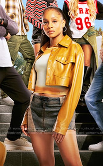 Simone’s mustard leather jacket and denim mini skirt on All American Homecoming