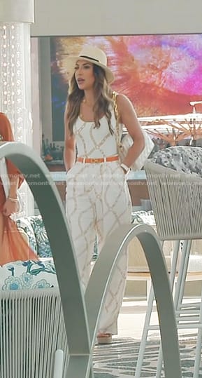 Taleen's white chain print swimsuit and pants on The Real Housewives of Dubai