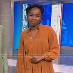 Zinhle’s orange pleated midi dress on NBC News Daily