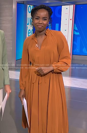 Zinhle's orange pleated midi dress on NBC News Daily