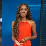 Zuri’s red pleated top and ruched skirt on Access Hollywood