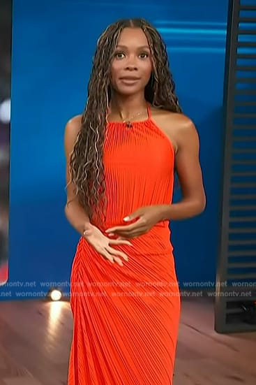 Zuri's red pleated top and ruched skirt on Access Hollywood