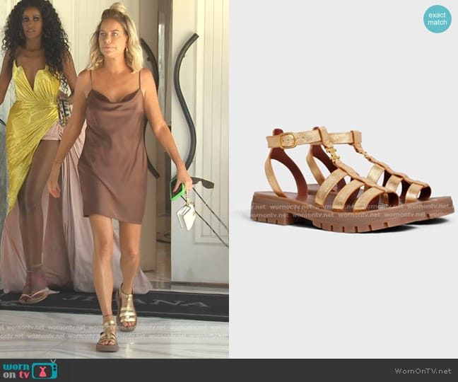 Celine Clea Triomphe Gladiator Sandal in Metalized Calfskin worn by Caroline Stanbury (Caroline Stanbury) on The Real Housewives of Dubai