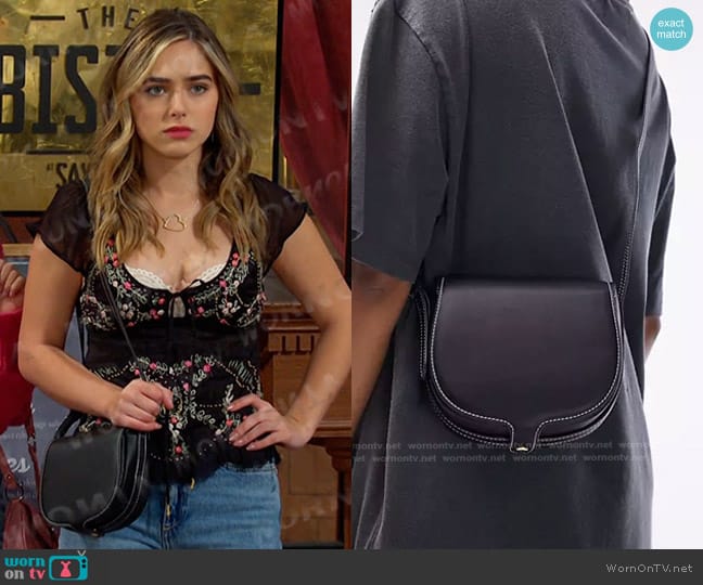 Topshop Chelsea Saddle Crossbody bag in black worn by Holly Jonas (Ashley Puzemis) on Days of our Lives