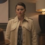 Mabel’s pleated trench coat and cardigan on Only Murders in the Building